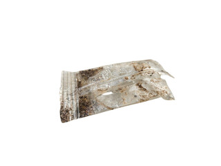 A piece of used food wrapper showing wear and tear, great for concepts of environmental concern, waste management, and sustainability. Isolated on white backgorund, transparent PNG