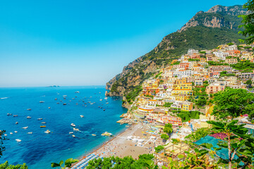 Positano coastline in south of Italy, vertiginous cliffs adorned with colorful villages, turquoise...