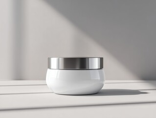 A white jar with a silver lid sits on a table