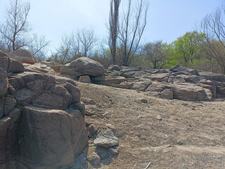 Interested gaze of an extreme sports enthusiast on the dangerous boulders of the Khortytsia coastal...