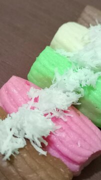 Colorful getuk with grated coconut topping.
 Gethuk is Indonesian Javanese snack made from cassava. 