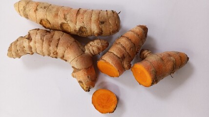 Close-up of turmeric on white background. Turmeric, a spice widely used in cooking and traditional medicine. Turmeric with white background