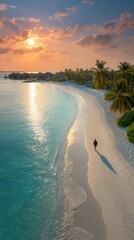 Sunset beach scene with lone figure.  Aerial view of tropical paradise