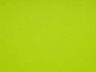 Bright green paper texture beckons with its vivid energy, inspiring visions of lush springtime...