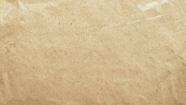 Abstract brown recycled paper background.
Old Kraft paper texture box craft pattern.
top view.
