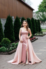 woman in pink dress in summer on street