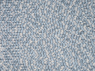 Soft blue and white wavy pattern on designer veneer surface