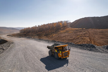 Open pit mine, extractive industry for gold ore, top view aerial drone.
