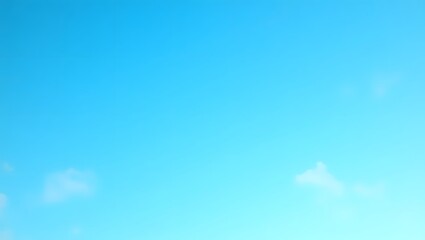 Bright Blue Sky with Soft White Clouds Floating on a Clear Day