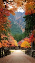 Autumnal path through a vibrant forest, leading to a mountain range