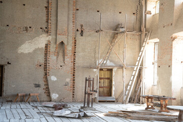 Historic construction and renovation site, refurbishing inside a great hall in a castle with tools...