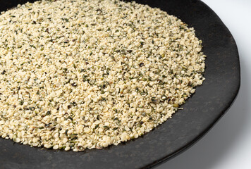 Shelled hemp seeds pile, peeled cannabis grains, marijuana kernels without peel