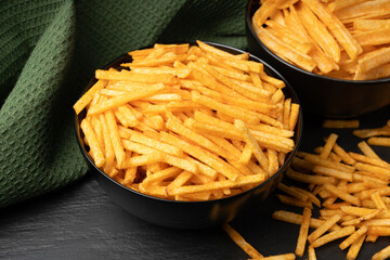 Fried chips sticks, finger potato chips, golden shoestring fries pile, French fries