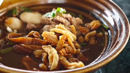 Bowl of boat noodle with pork.
