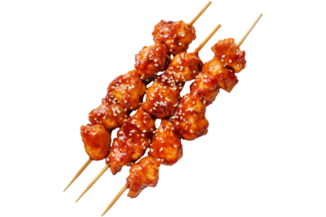 Grilled Korean Dakkochi chicken skewers coated in glossy sesame glaze,isolated on white transparent background, concept of Asian cuisine