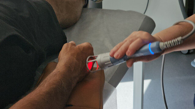 Therapeutic laser treatment session at a clinic showing patient receiving care concept