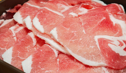Pork cut into pieces on a square plate