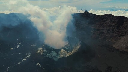 4K drone footage of Mount Raung at sunrise, revealing steep ridges, misty forests, and one of Indonesia’s most extreme hiking trails with cloud and vulcano  - Powered by Adobe