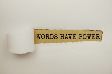 Words Have Power message written on craft paper with torn paper background