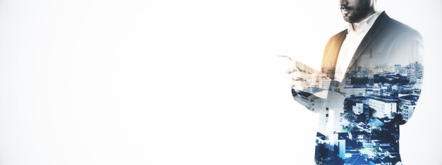 Businessman using smartphone with cityscape overlay on white background, creative double exposure concept for banner or template design.