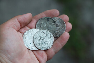 Huge medieval european silver coins in hand