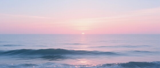 Serene pink sunset paints the ocean