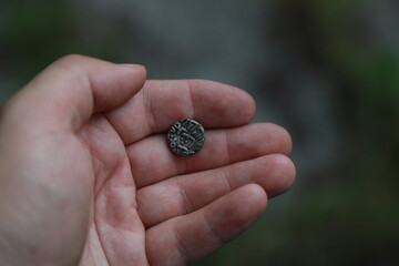 Ancient coin of India in hand