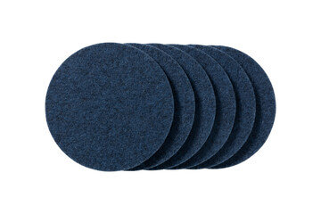 Stack of five round dark blue felt coasters isolated on transparent background