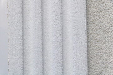 Close-up of a white towel on a wall, detailed shot,
