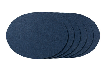 Stack of round dark blue felt coasters isolated on transparent background