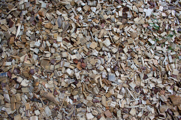 Textured wooden background. Mulch for landscape and gardening. Natural recycled cellulose.