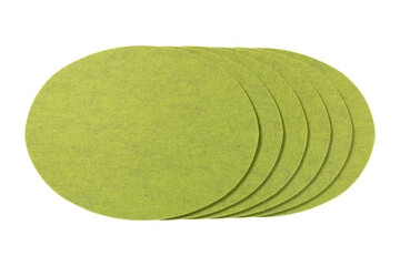 Group of six lime green felt circular placemats arranged in a fanned pattern isolated on...