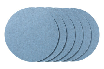 Stack of light blue circular felt coasters isolated on transparent background