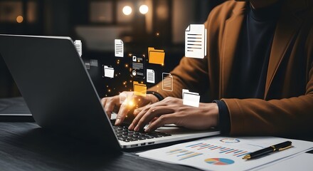 Person working on a laptop with floating document icons represents cloud storage and data management for enhanced digital workflows and information access.