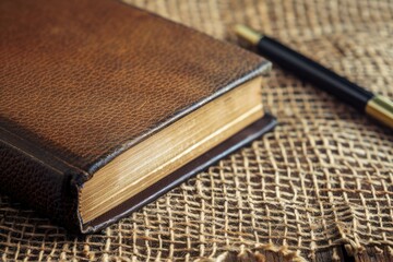 Detailed Visual  of a Book with a Pencil on it Sits on a Table with a Pen on it