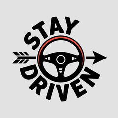 Stay driven motivational phrase with a steering wheel and arrow graphic symbolizing progress and determination in driving and life