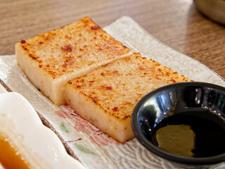 Pan-Fried Turnip Cake. Crispy edge, soft savory radish cubes