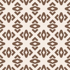 Geometric brown shapes repeated on a cream colored surface. Tribal Diamond Cross repeat seamless pattern background. Bold cross and diamond shapes motif pattern.