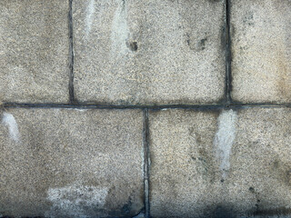 Old Stone Wall with Mold in Cracks – Aged Structure Texture

