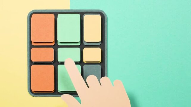 Papercraft Animation: Hand Interacting with Colorful Button Grid on Split Yellow and Teal Background