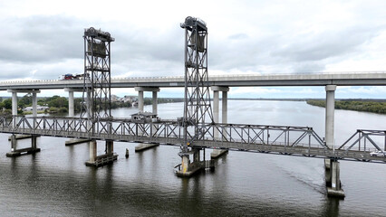 A stunning Aerial View of Pacific Highway Harwood Bridge crosses the Clarence River under a cloudy sky in the Northern Rivers region of New South Wales, Australia 