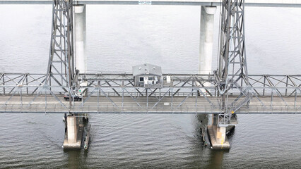A stunning Aerial View of Pacific Highway Harwood Bridge crosses the Clarence River under a cloudy sky in the Northern Rivers region of New South Wales, Australia 