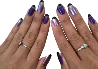 Female hands waring diamond ring with purple black and glittery Self nail painted isolated