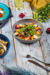 different salads with meat and seafood