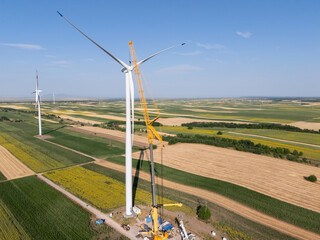 Wind turbine installation using a large construction crane. The assembly process of the turbine...