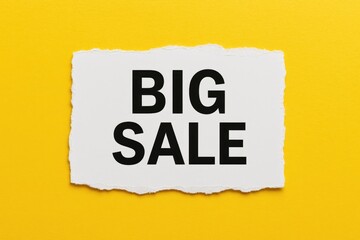 Bright yellow backdrop featuring a torn white paper with bold sale announcement