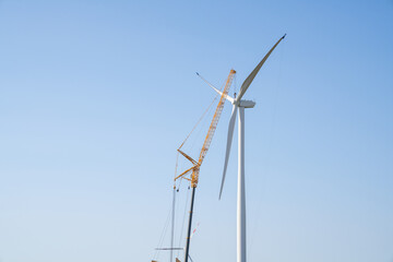 Wind turbine installation using a large construction crane. The assembly process of the turbine...