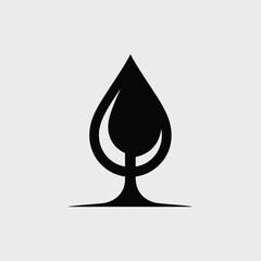 Fototapeta premium Black Silhouette of a Water Drop Shaped Like a Wine Glass on a Light Gray Background Simple Minimalist Design Element