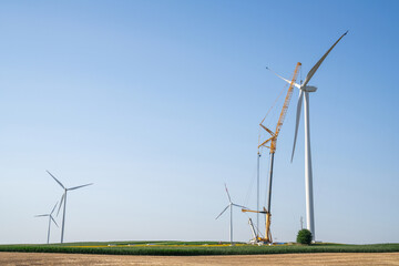 Wind turbine installation using a large construction crane. The assembly process of the turbine...