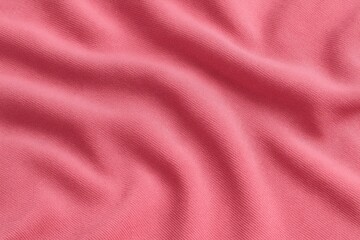 Close-up of a gently rippled pink fabric featuring a soft, colorful textile pattern and textured material surface.